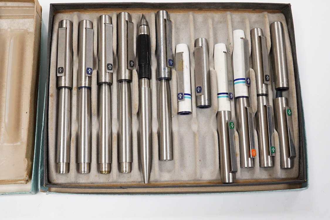 A quantity of Parker 25 fountain pens and ballpen spares including rare orange parts